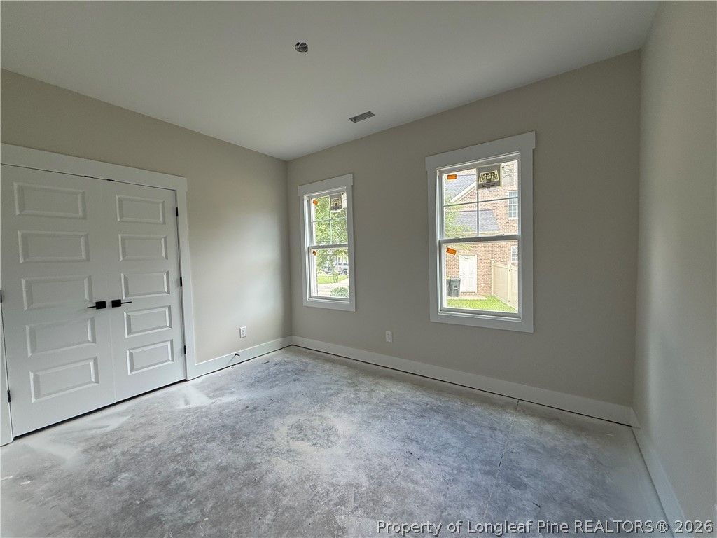 154 Ridge Stone Drive Autryville, NC 28318 - Photo 12 of 17 an empty room with windows and closet