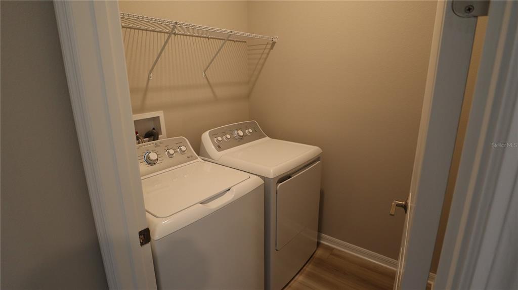 984 Top Minnow Road St. Cloud, FL 34771 - Photo 13 of 31 a utility room with dryer and washer