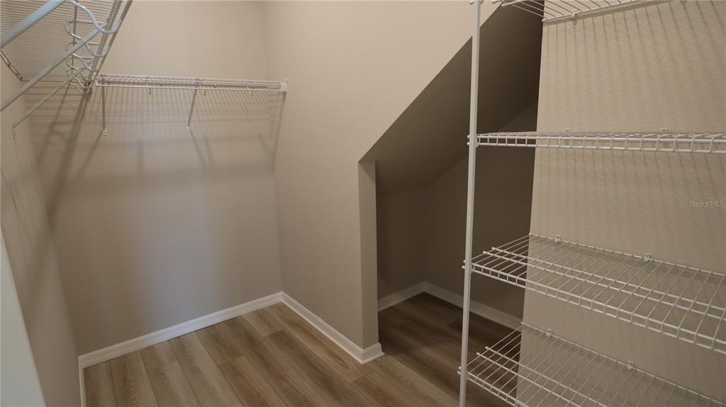 984 Top Minnow Road St. Cloud, FL 34771 - Photo 16 of 31 a view of wooden floor in a room