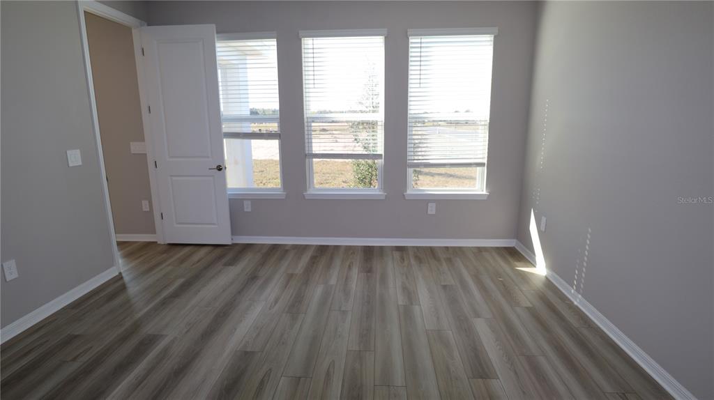 984 Top Minnow Road St. Cloud, FL 34771 - Photo 17 of 31 a view of an empty room and window