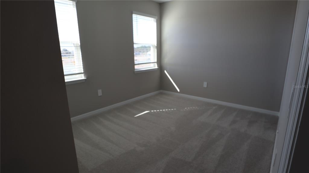 984 Top Minnow Road St. Cloud, FL 34771 - Photo 20 of 31 a view of empty room with window