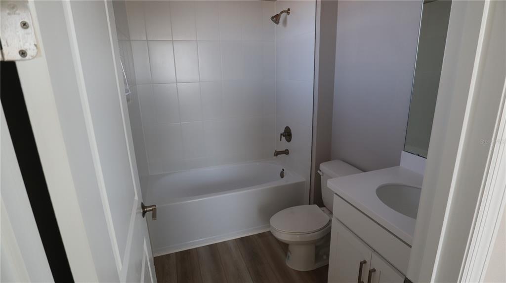 984 Top Minnow Road St. Cloud, FL 34771 - Photo 21 of 31 a bathroom with a sink and a toilet