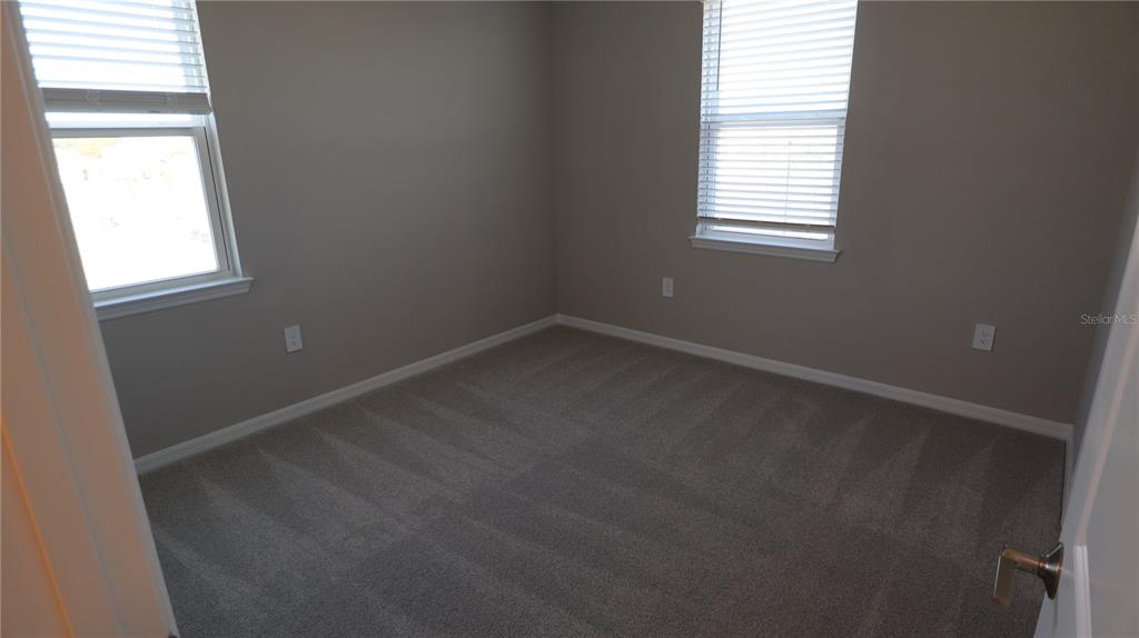 984 Top Minnow Road St. Cloud, FL 34771 - Photo 25 of 31 an empty room with windows