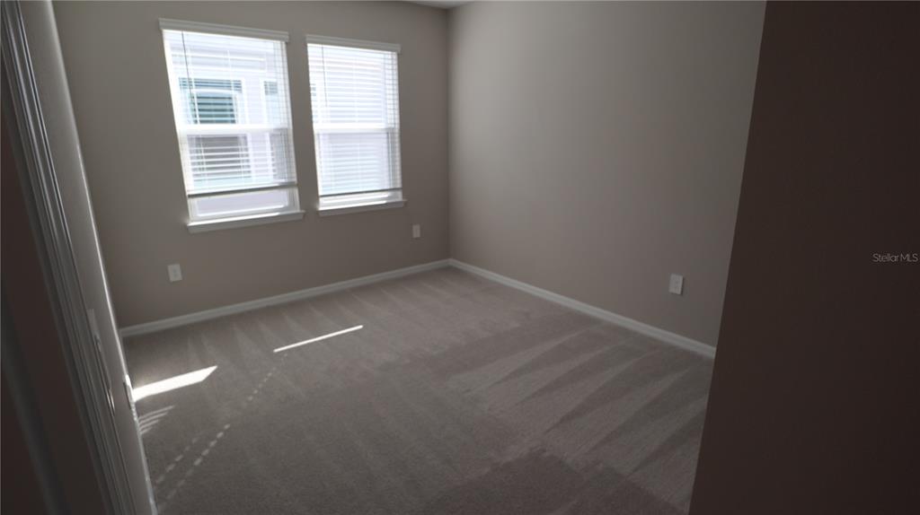984 Top Minnow Road St. Cloud, FL 34771 - Photo 29 of 31 an empty room with windows