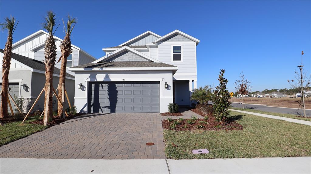 984 Top Minnow Road St. Cloud, FL 34771 - Photo 3 of 31 a view of a house with a yard