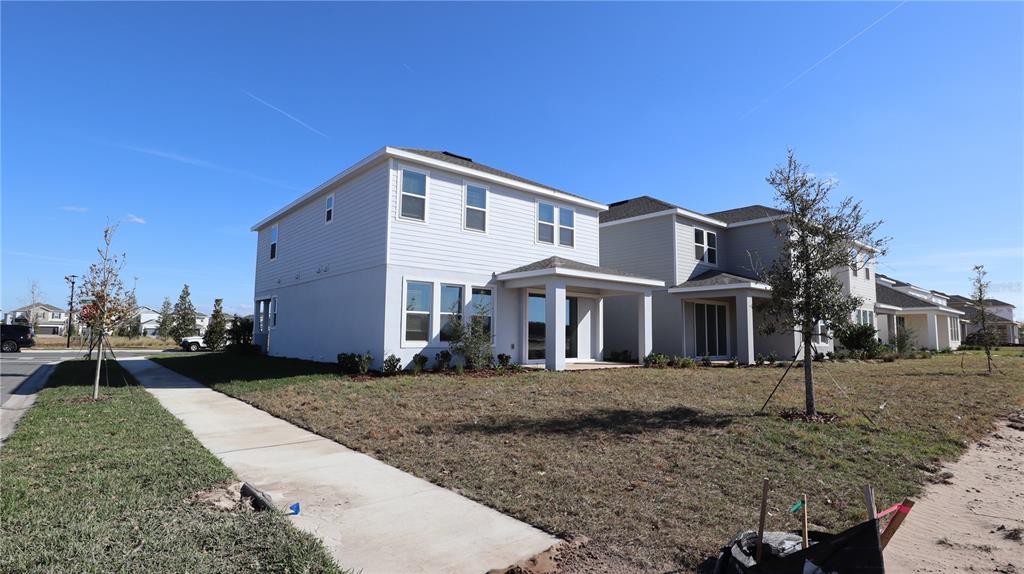 984 Top Minnow Road St. Cloud, FL 34771 - Photo 4 of 31 a front view of a house with a yard