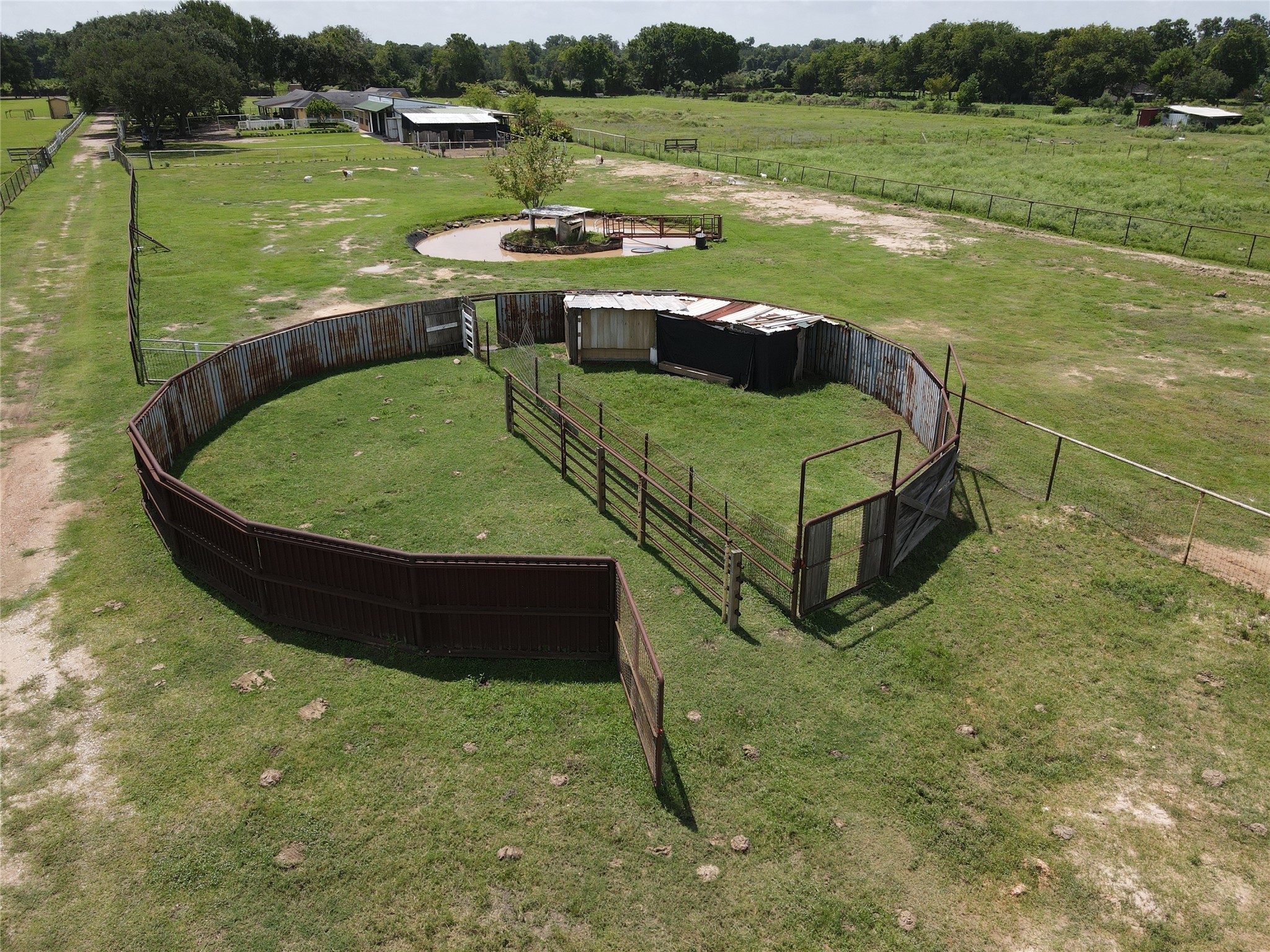 37110 Donigan Road Brookshire, TX 77423 - Photo 15 of 43 a view of a lake with a yard and a large tree