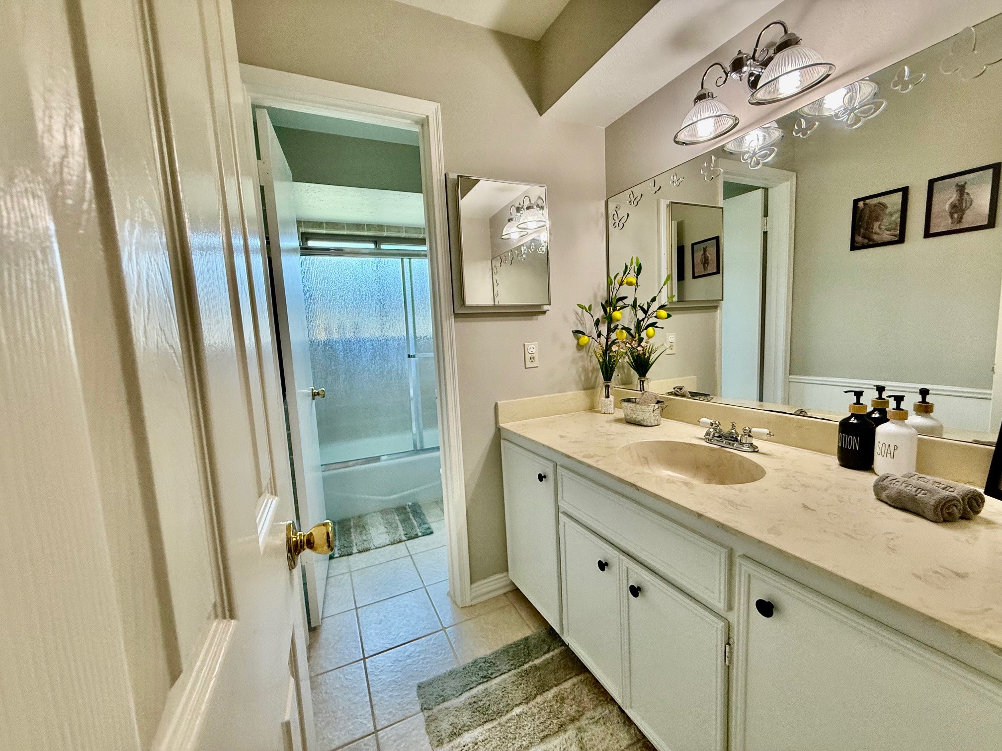 37110 Donigan Road Brookshire, TX 77423 - Photo 34 of 43 a spacious bathroom with a double vanity sink a large mirror a shower and vanity