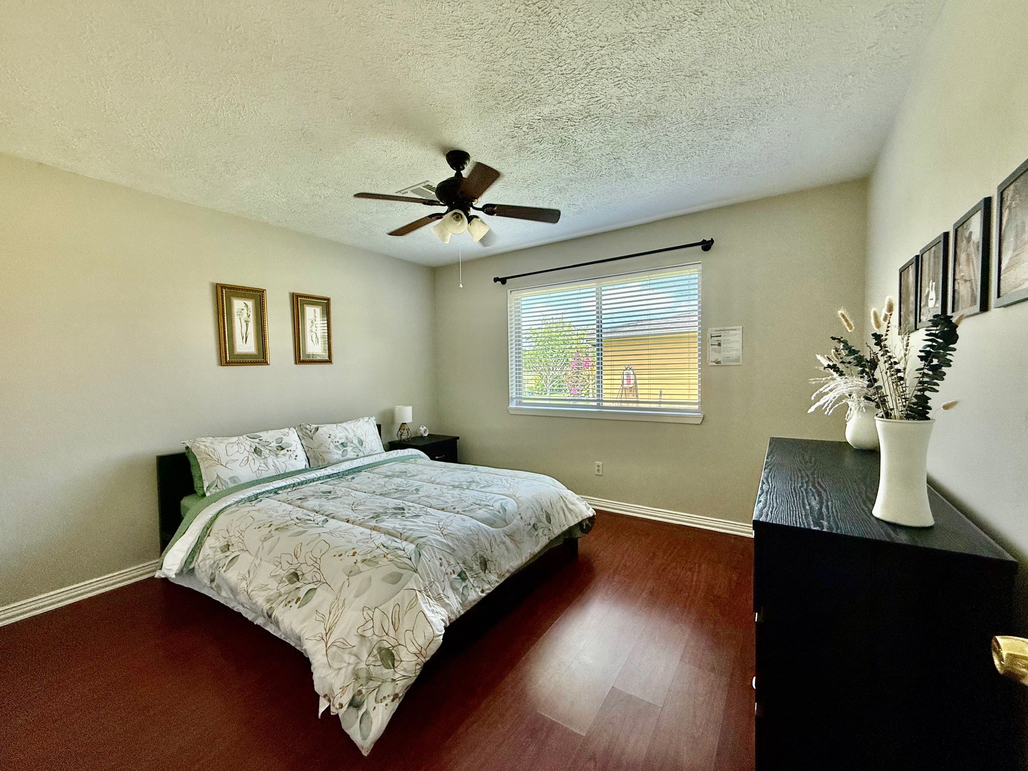 37110 Donigan Road Brookshire, TX 77423 - Photo 35 of 43 a bedroom with a large bed chandelier and a window