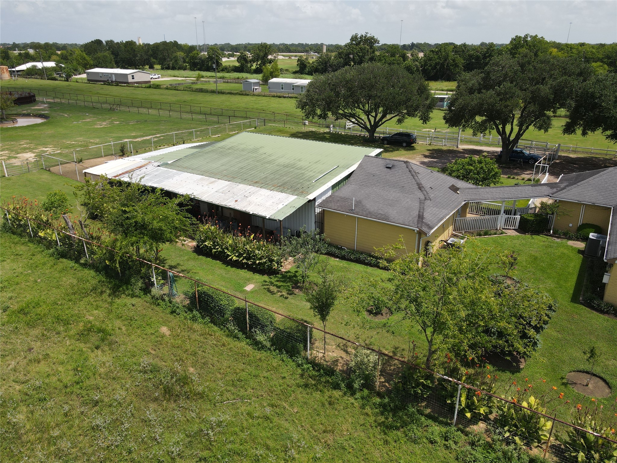 37110 Donigan Road Brookshire, TX 77423 - Photo 9 of 43 an aerial view of a house with a yard and lake view