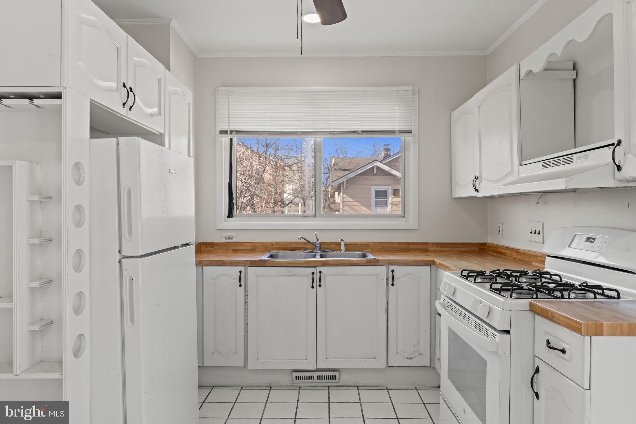 500 Arndt Avenue Riverside, NJ 08075 - Photo 12 of 27 a kitchen with white cabinets and white appliances