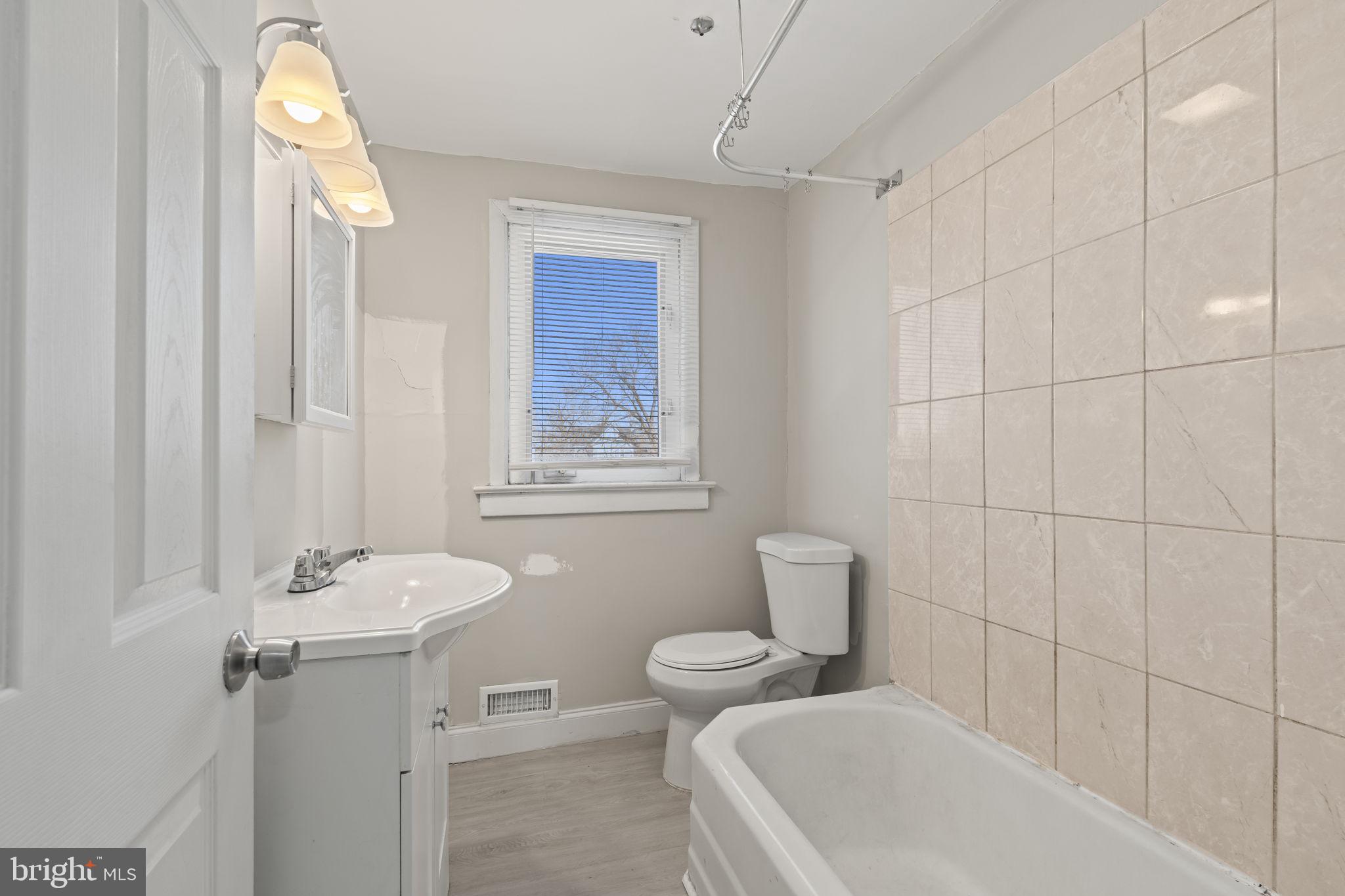 500 Arndt Avenue Riverside, NJ 08075 - Photo 15 of 27 a bathroom with a toilet a sink and bathtub