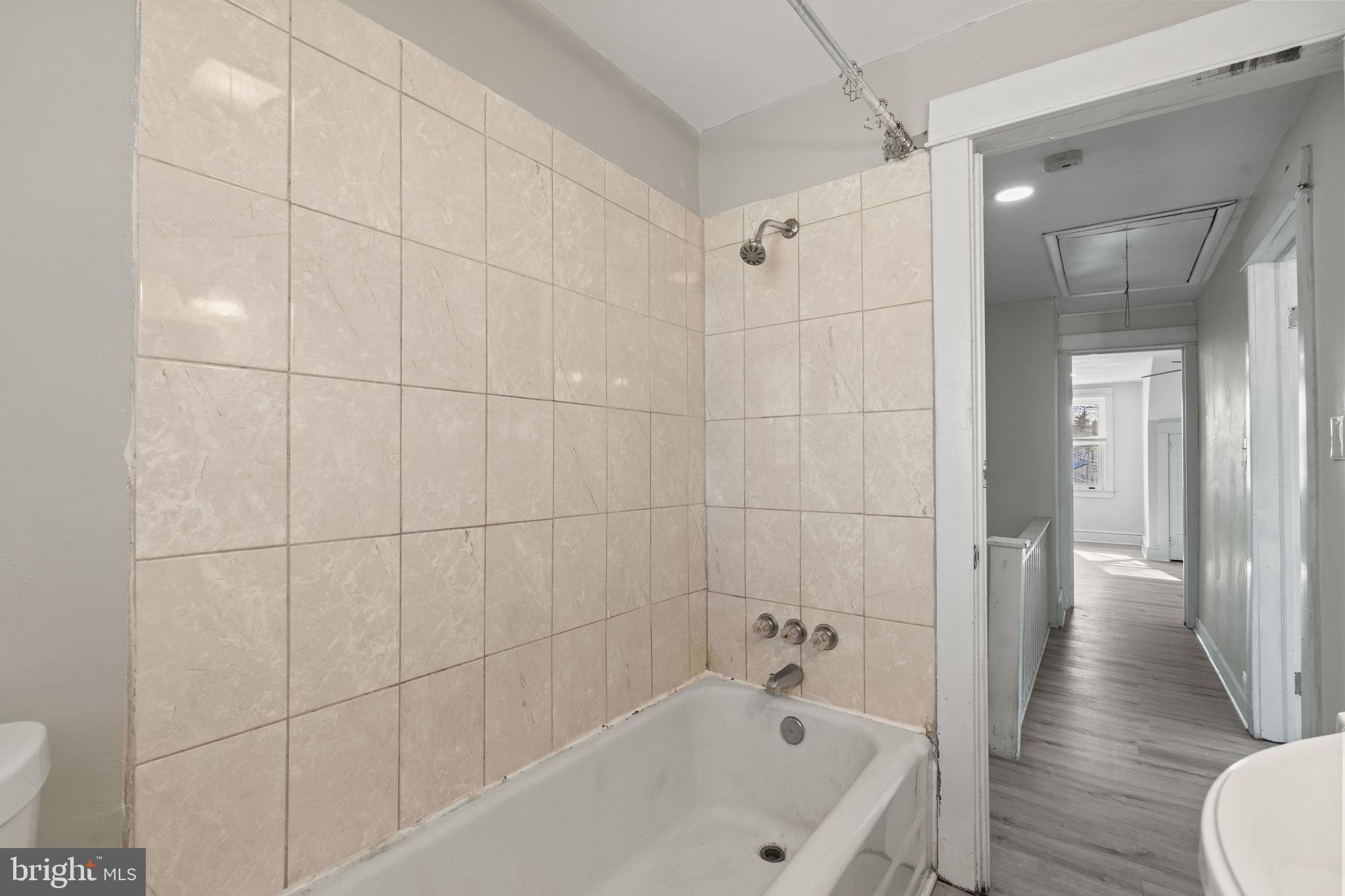 500 Arndt Avenue Riverside, NJ 08075 - Photo 16 of 27 a bathroom with a bathtub and a shower