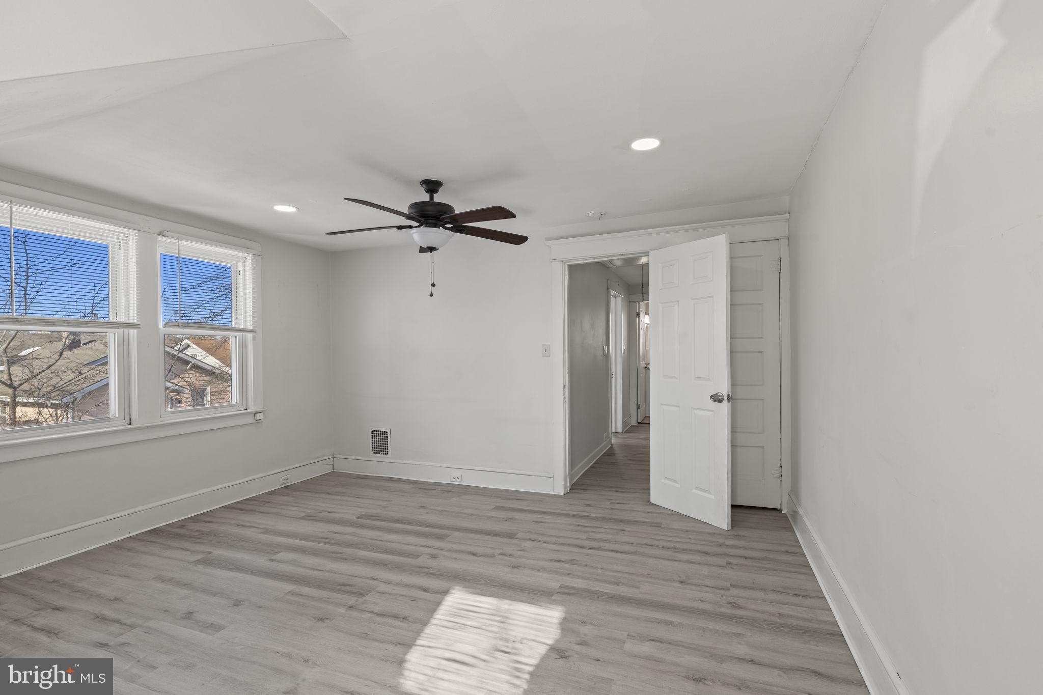 500 Arndt Avenue Riverside, NJ 08075 - Photo 21 of 27 a view of an empty room with a window and wooden floor
