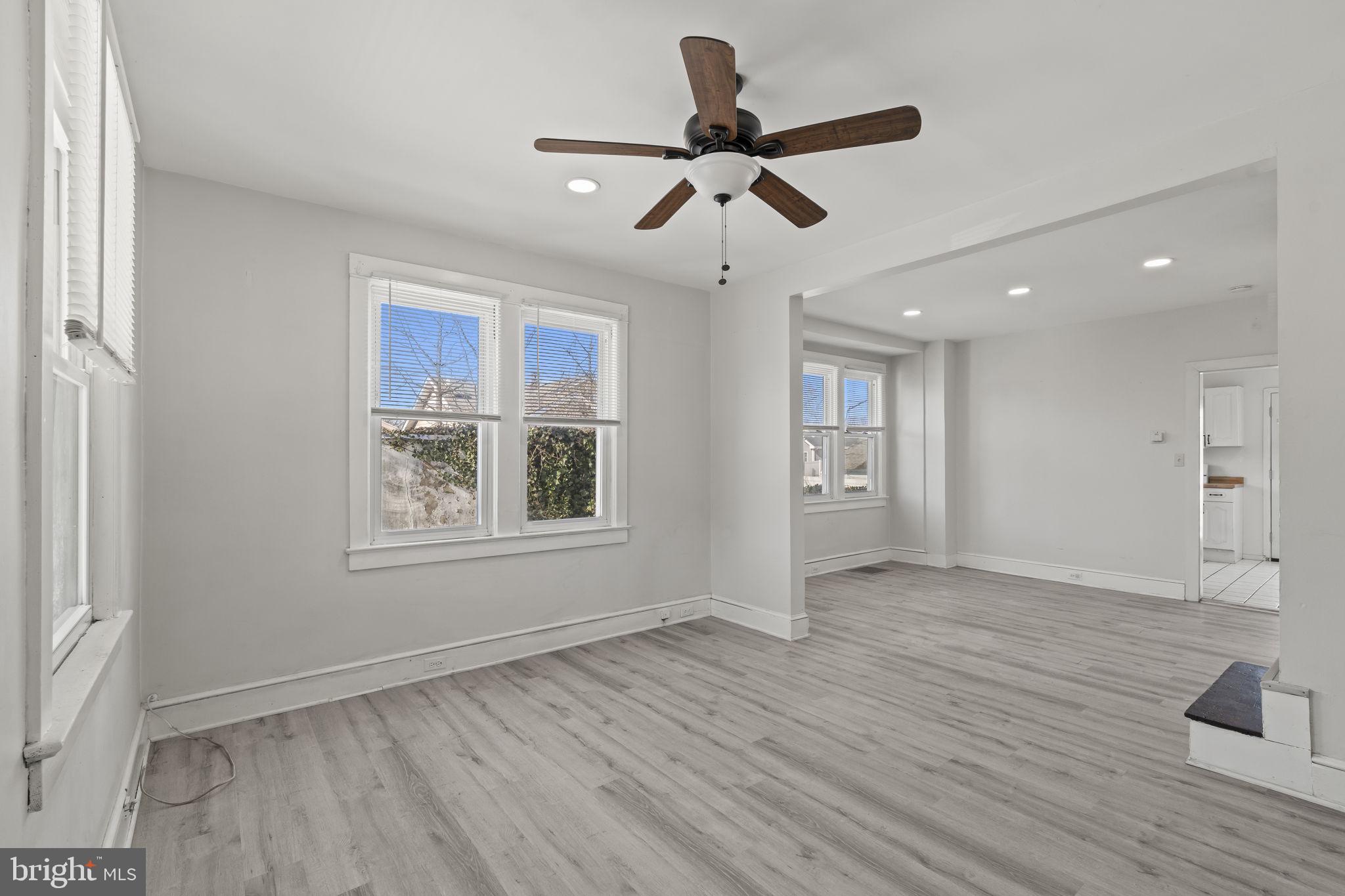 500 Arndt Avenue Riverside, NJ 08075 - Photo 4 of 27 a view of an empty room with a window and wooden floor