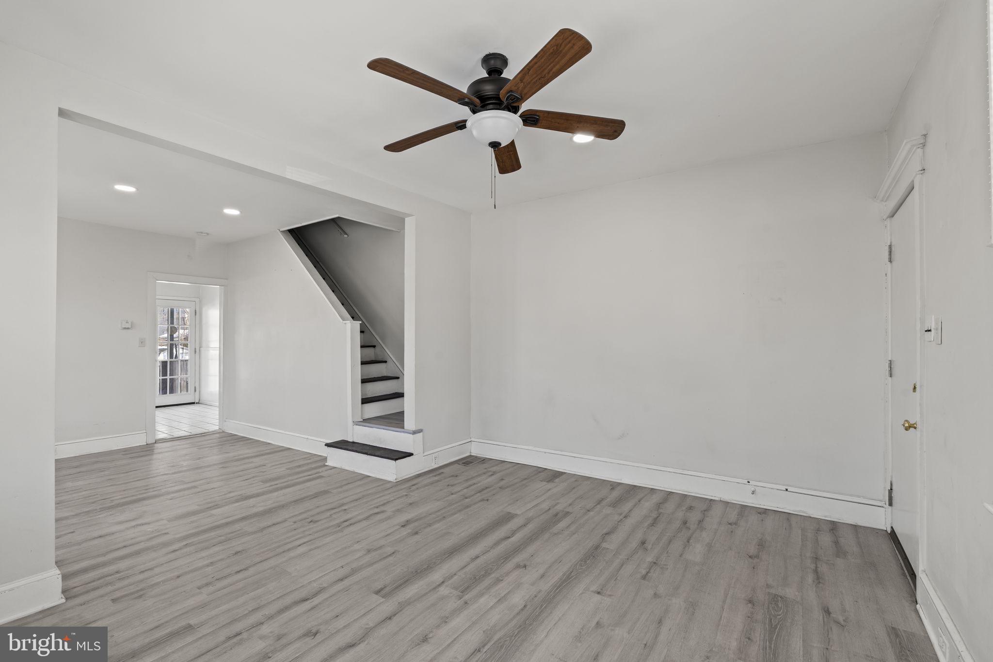 500 Arndt Avenue Riverside, NJ 08075 - Photo 5 of 27 a view of an empty room with wooden floor and a ceiling fan