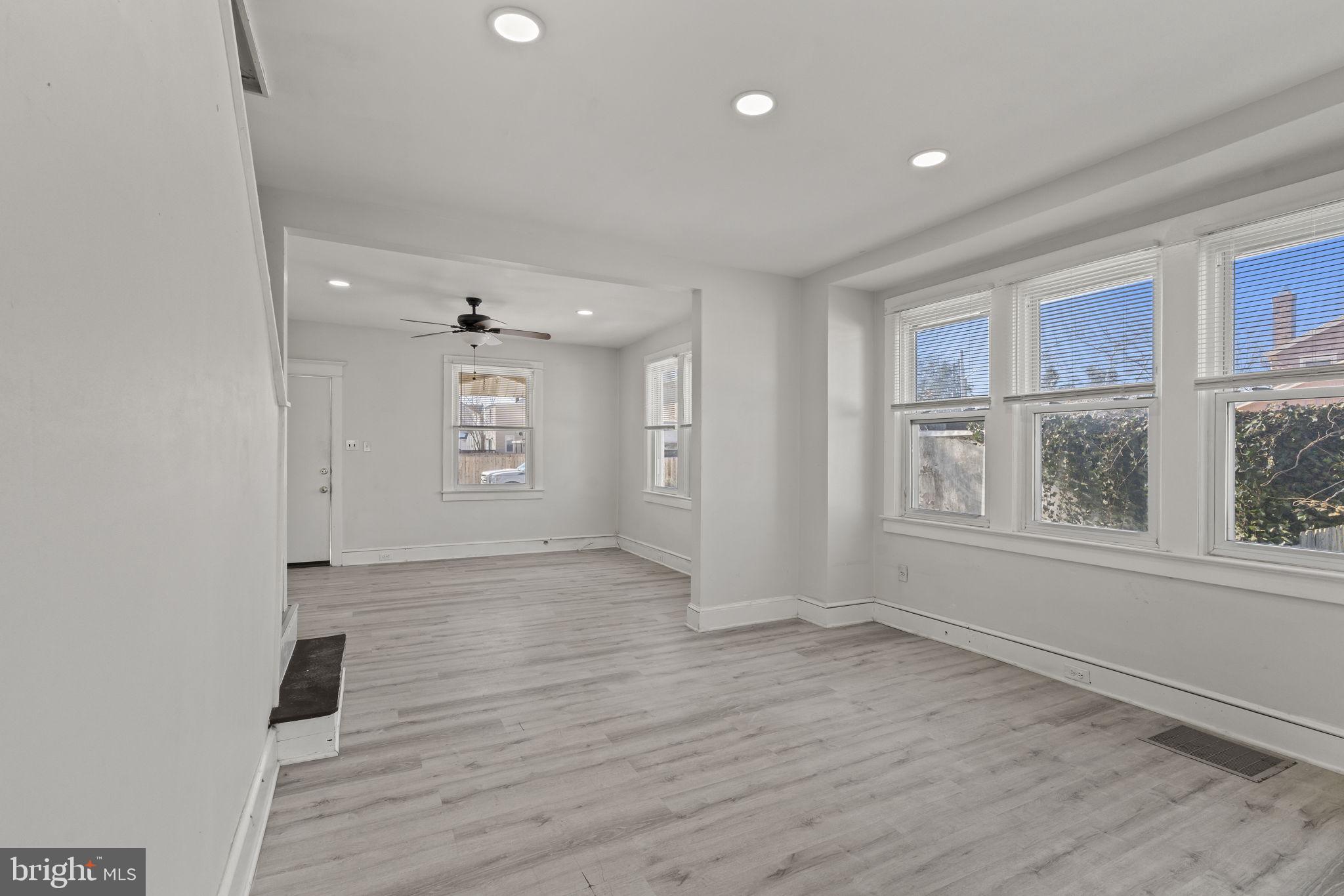 500 Arndt Avenue Riverside, NJ 08075 - Photo 8 of 27 an empty room with wooden floor and windows