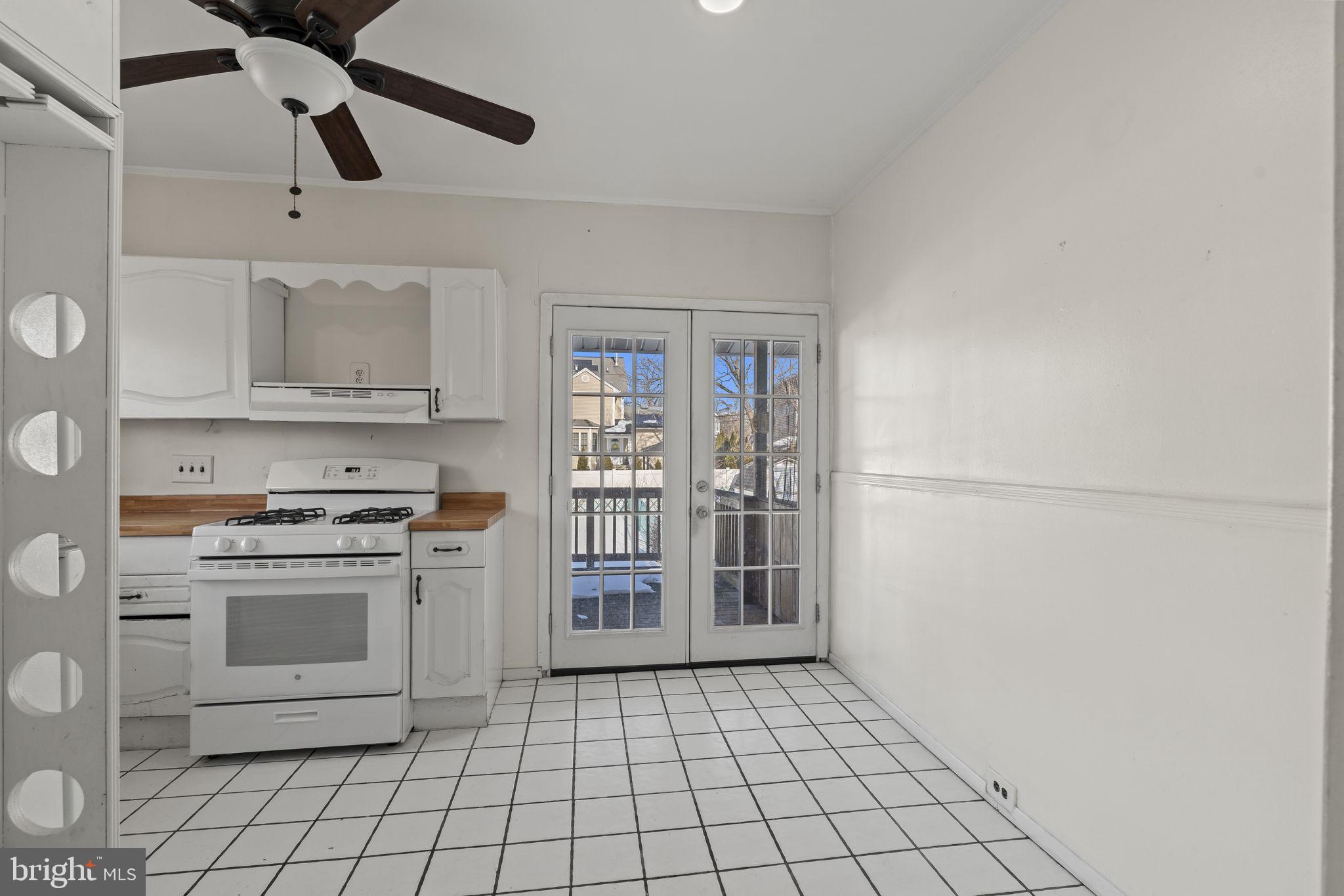 500 Arndt Avenue Riverside, NJ 08075 - Photo 9 of 27 a kitchen with stainless steel appliances a stove refrigerator and cabinets