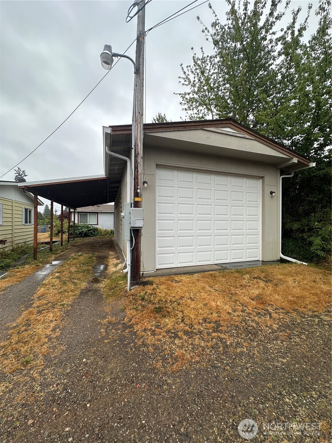 a backyard of a house with shaded area