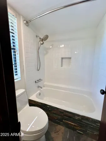 a bathroom with a sink a toilet and a bathtub
