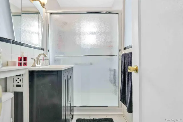 a kitchen with stainless steel appliances granite countertop a refrigerator and a stove