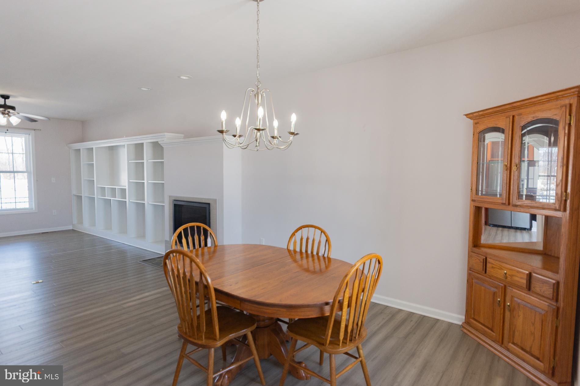 528 Delmar Orchard Road Martinsburg, WV 25403 - Photo 12 of 72 a view of a dining room with furniture wooden floor and chandelier