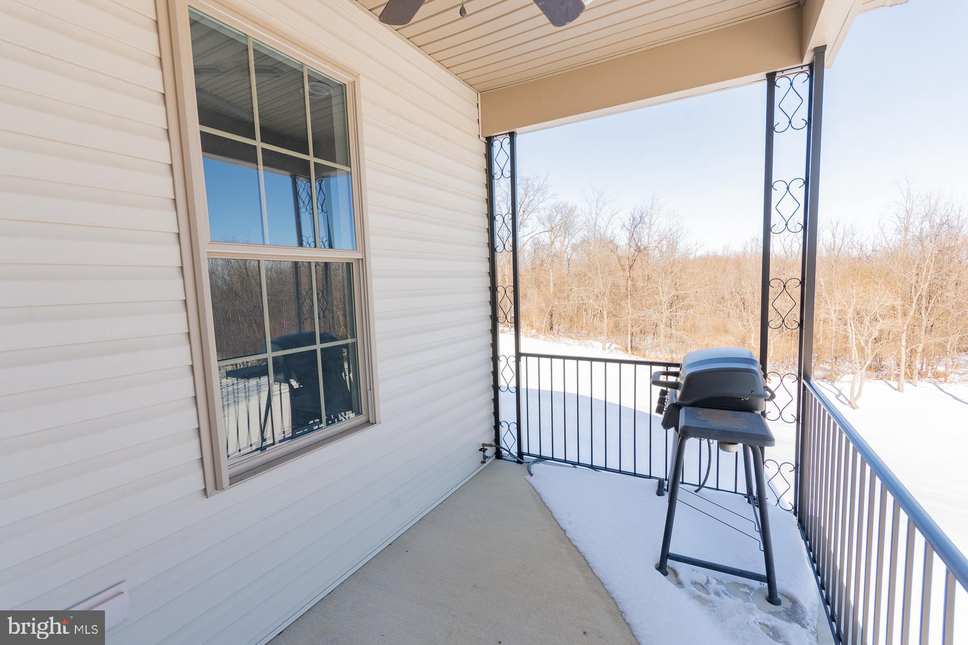 528 Delmar Orchard Road Martinsburg, WV 25403 - Photo 17 of 72 a view of a balcony with furniture and wooden deck