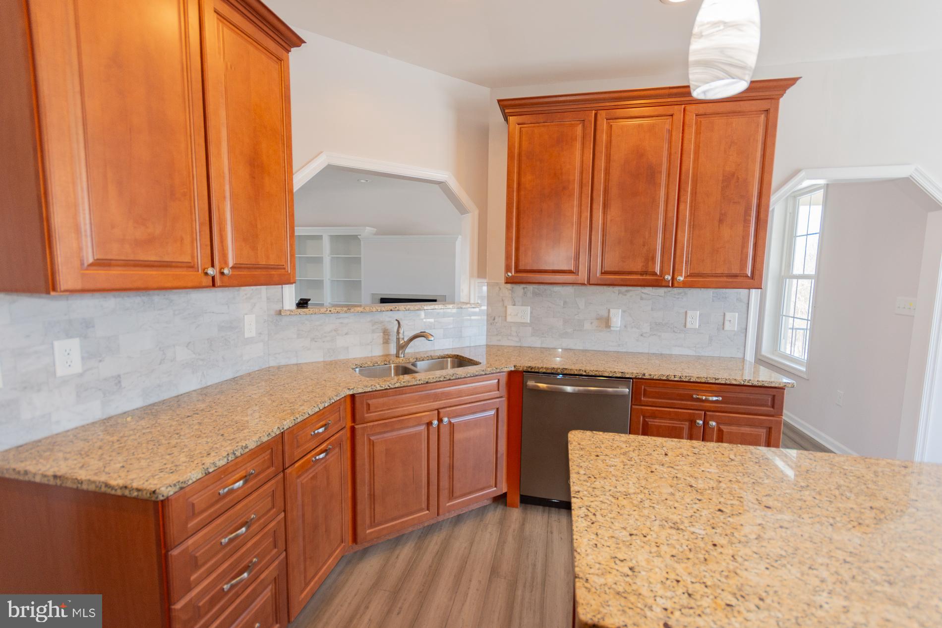528 Delmar Orchard Road Martinsburg, WV 25403 - Photo 24 of 72 a kitchen with stainless steel appliances granite countertop wooden cabinets a sink and dishwasher