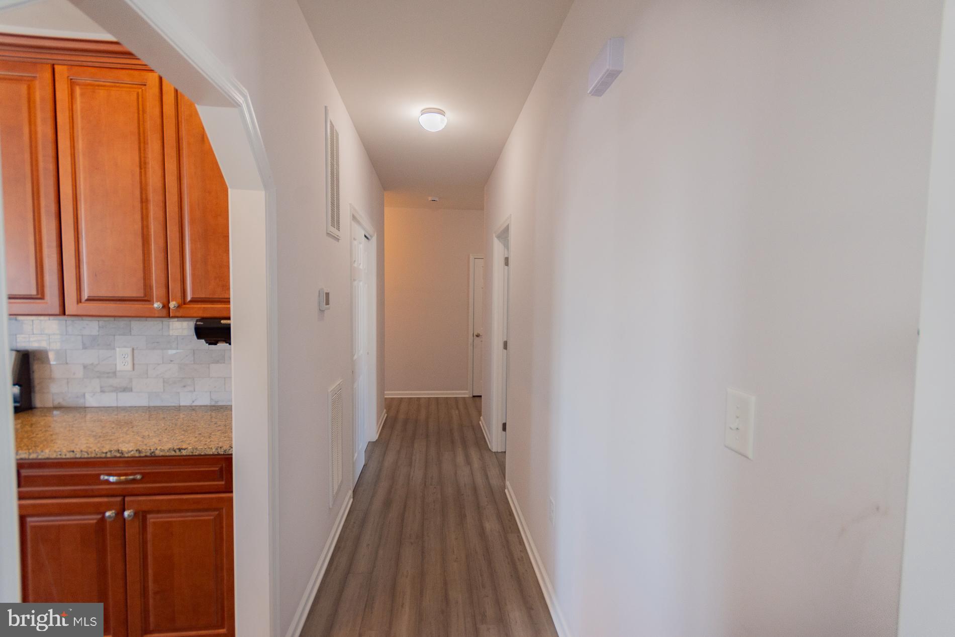 528 Delmar Orchard Road Martinsburg, WV 25403 - Photo 25 of 72 a view of a hallway with wooden floor and a window