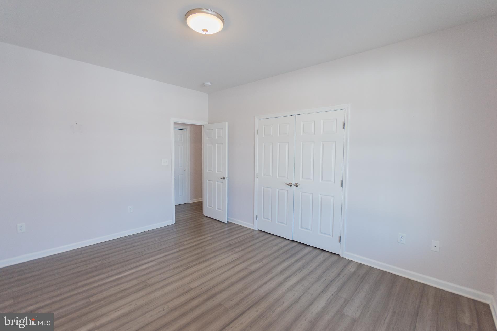 528 Delmar Orchard Road Martinsburg, WV 25403 - Photo 28 of 72 a view of an empty room with wooden floor