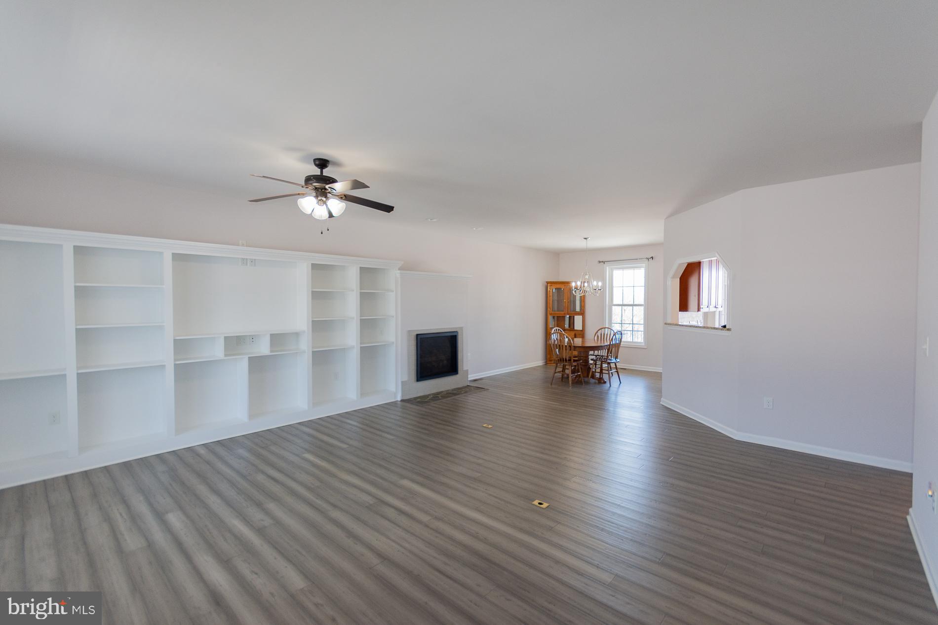528 Delmar Orchard Road Martinsburg, WV 25403 - Photo 3 of 72 a view of empty room with wooden floor and fireplace