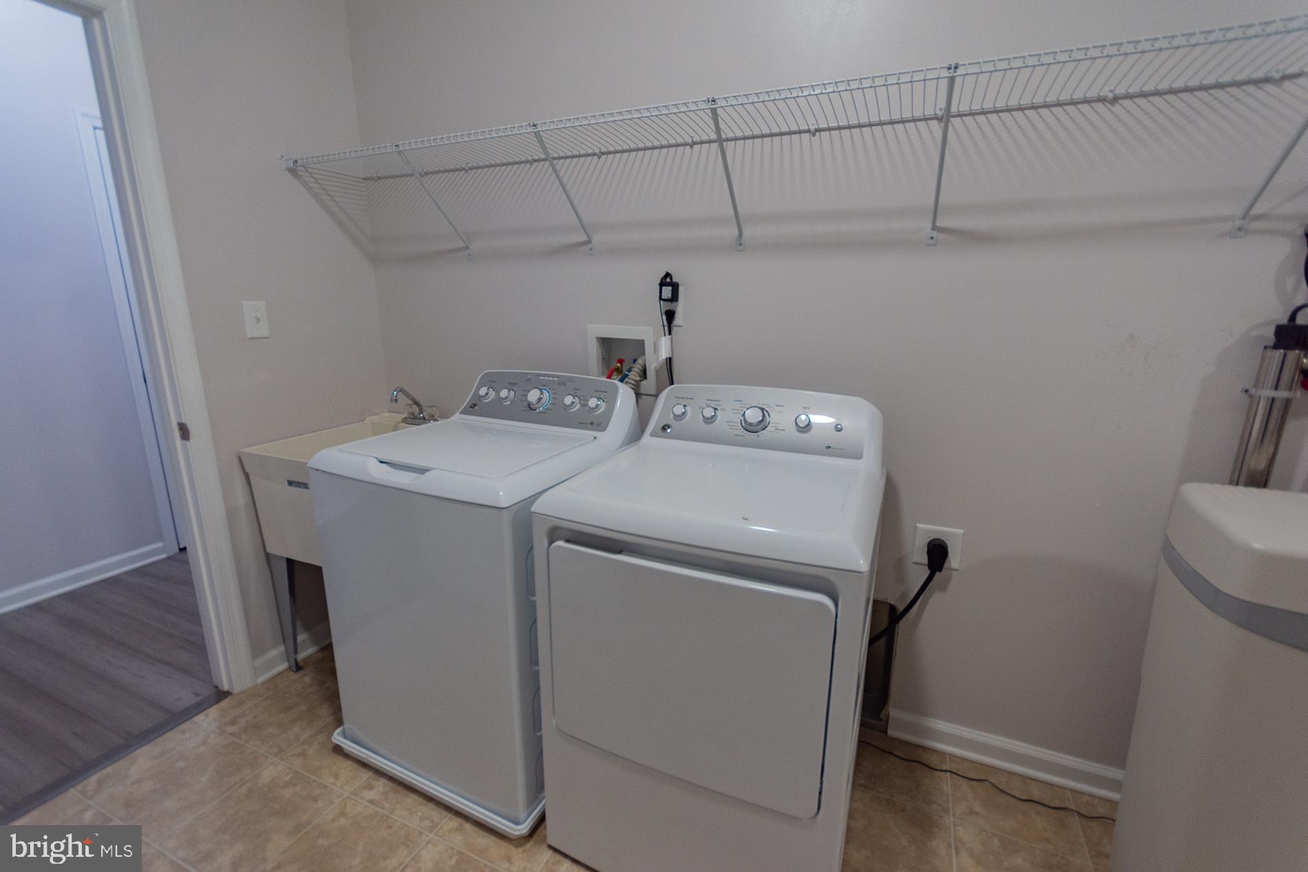 528 Delmar Orchard Road Martinsburg, WV 25403 - Photo 34 of 72 a utility room with dryer and washer