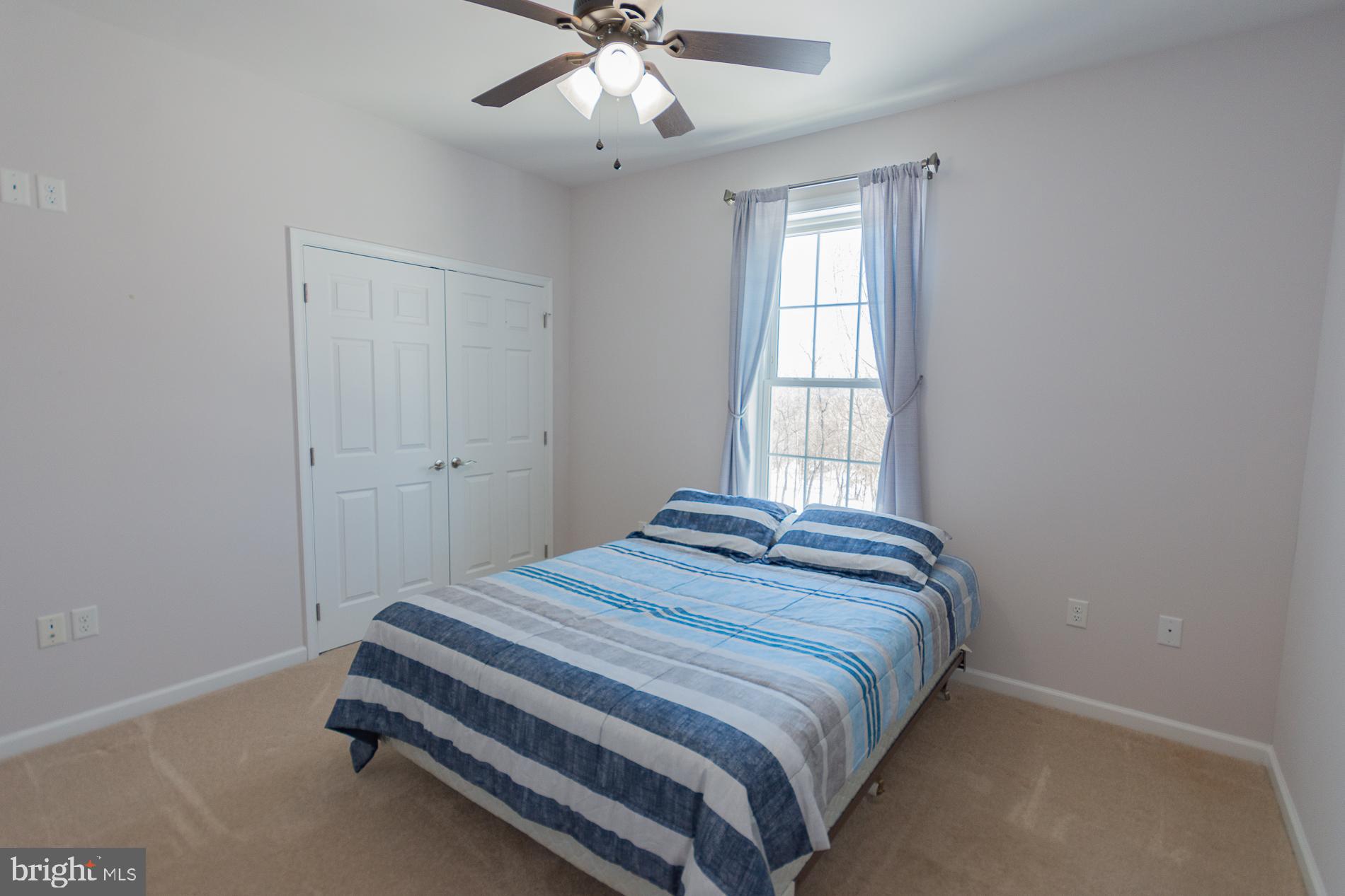 528 Delmar Orchard Road Martinsburg, WV 25403 - Photo 36 of 72 a bedroom with a bed and window