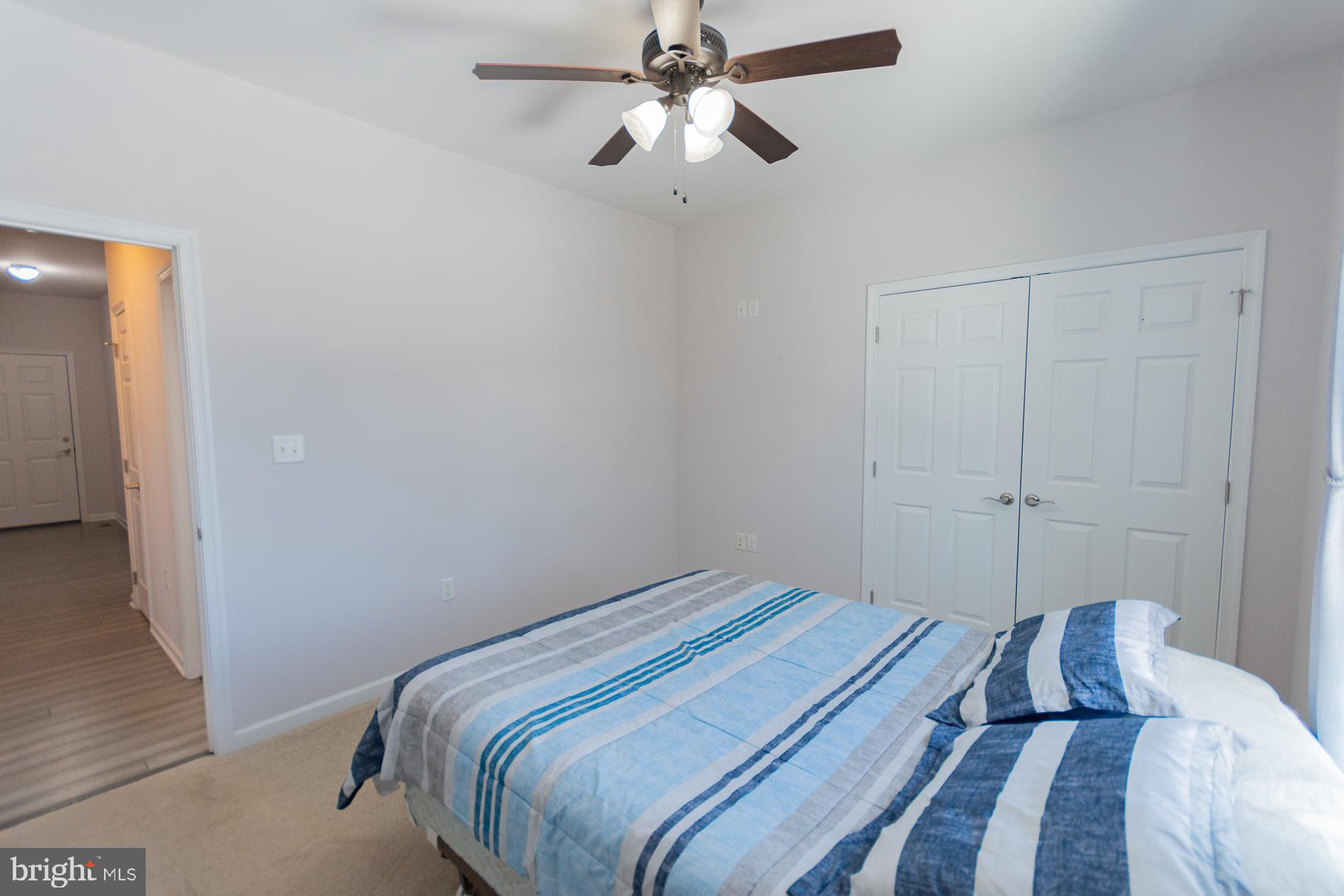 528 Delmar Orchard Road Martinsburg, WV 25403 - Photo 39 of 72 a bedroom with a bed and a chandelier
