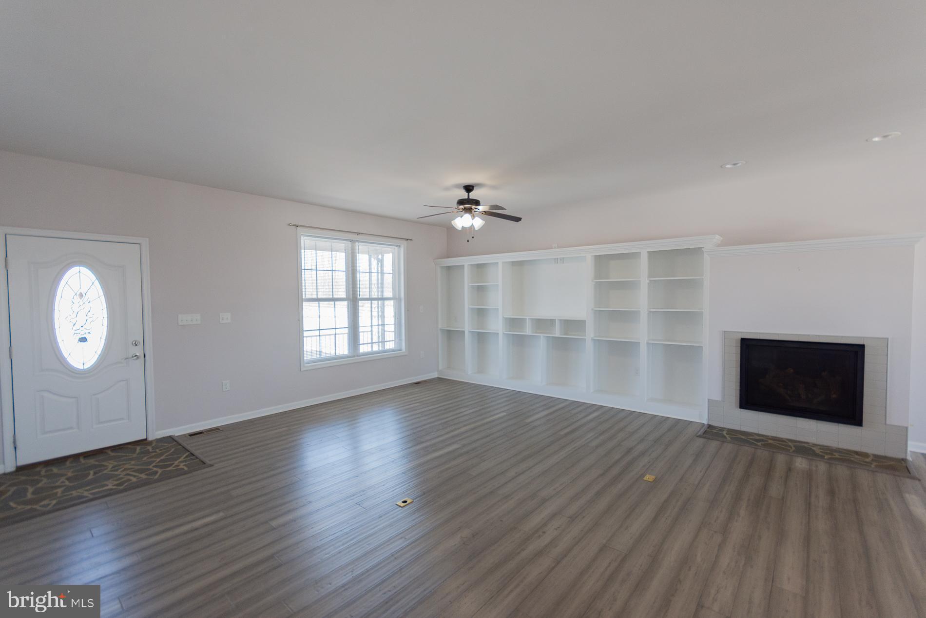 528 Delmar Orchard Road Martinsburg, WV 25403 - Photo 4 of 72 wooden floor in an empty room with a window