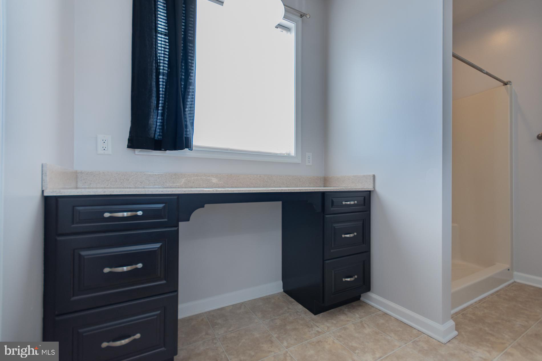 528 Delmar Orchard Road Martinsburg, WV 25403 - Photo 45 of 72 a bathroom with a sink and a mirror