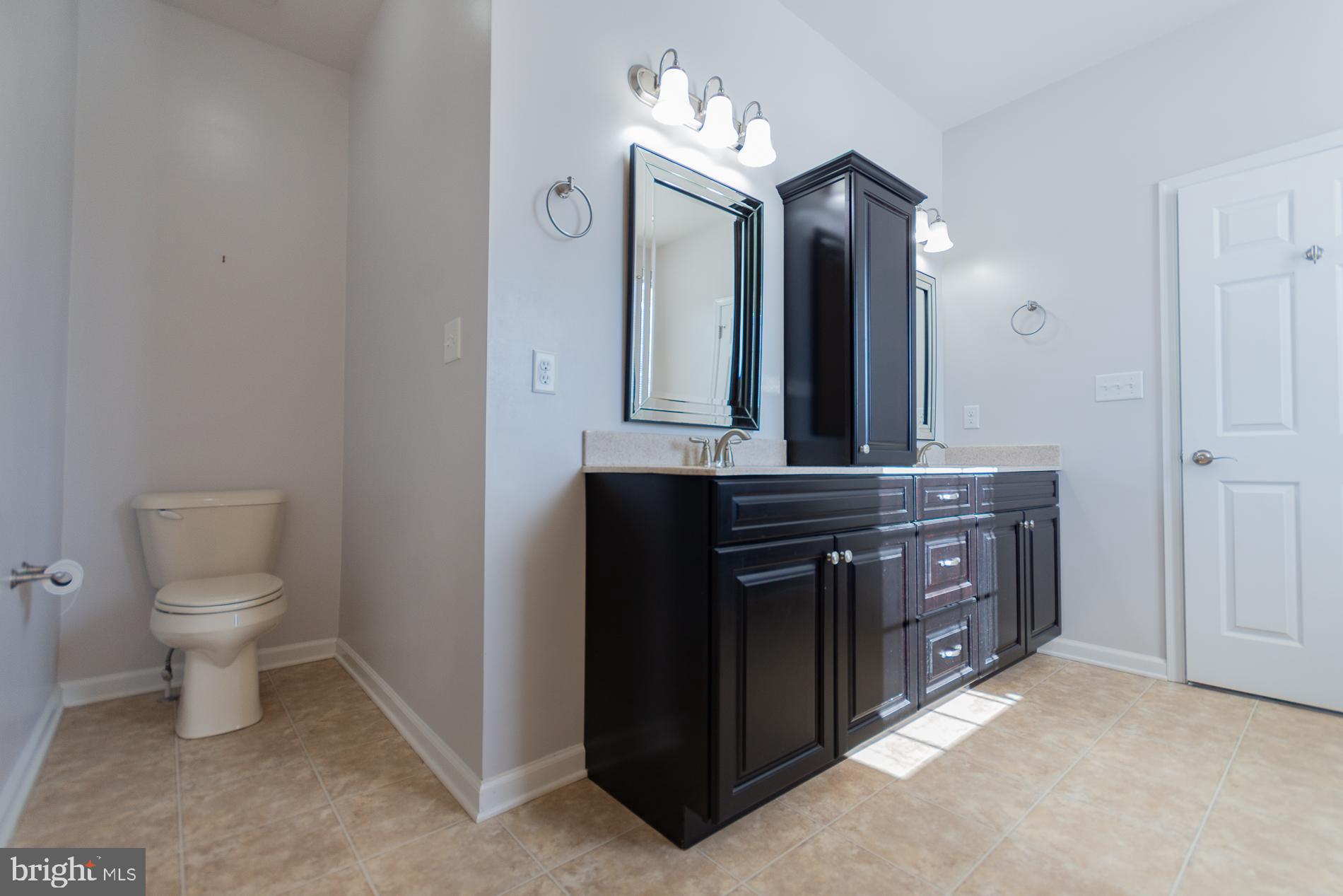 528 Delmar Orchard Road Martinsburg, WV 25403 - Photo 48 of 72 a bathroom with a sink vanity and a mirror