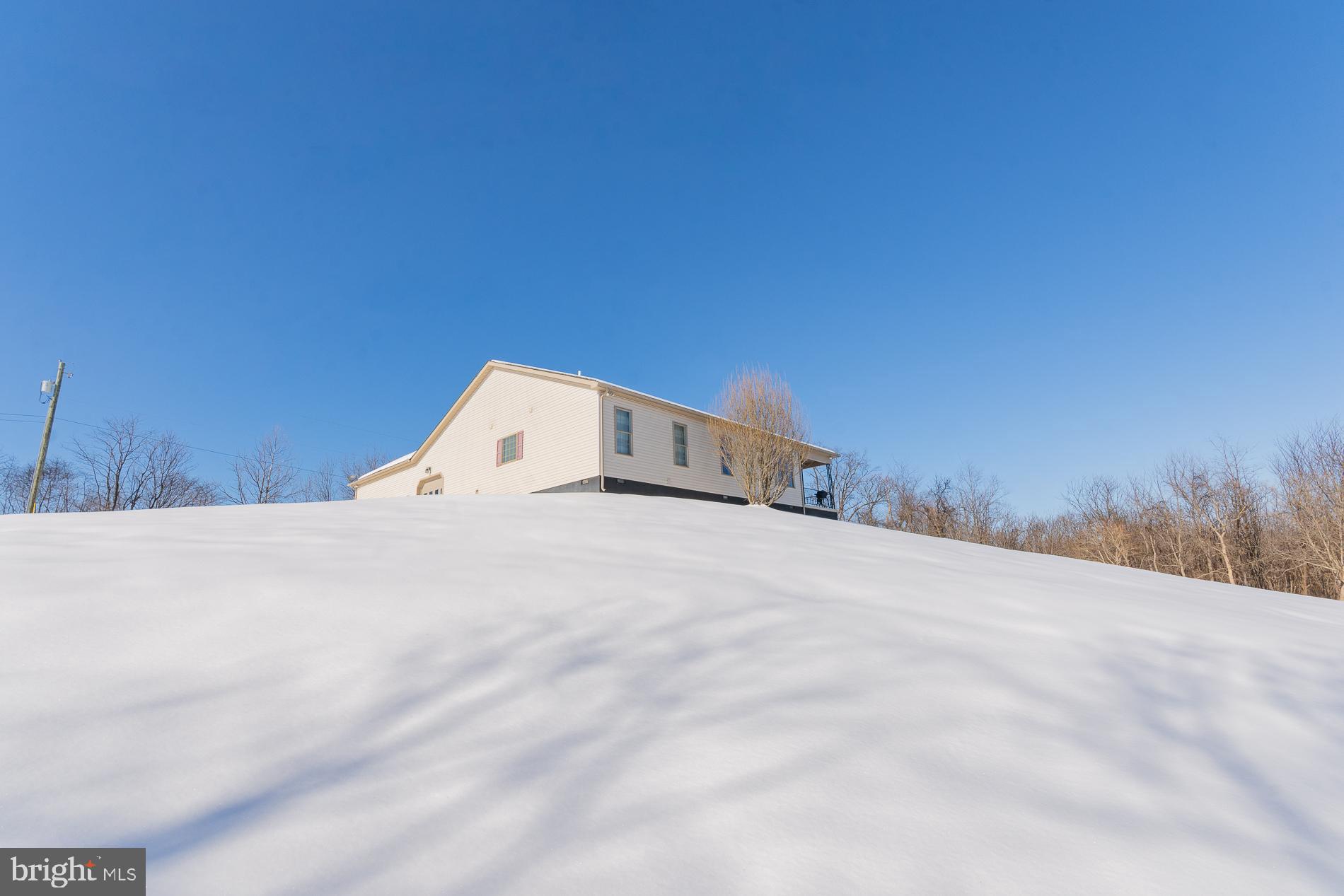 528 Delmar Orchard Road Martinsburg, WV 25403 - Photo 64 of 72 a view of a big room with a bed