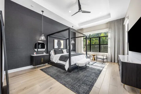 a view of living room with furniture and large window