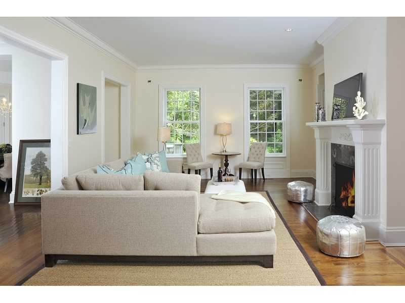 47 Round Hill Road Greenwich, CT 06831 - Photo 13 of 22 a living room with furniture a fireplace and a large window