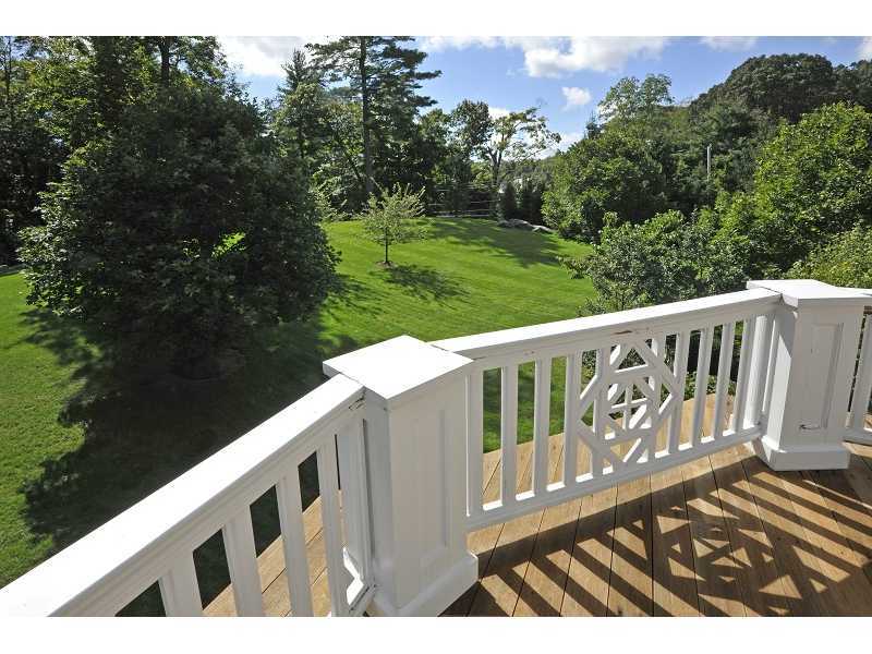 47 Round Hill Road Greenwich, CT 06831 - Photo 20 of 22 a view of a wooden fence