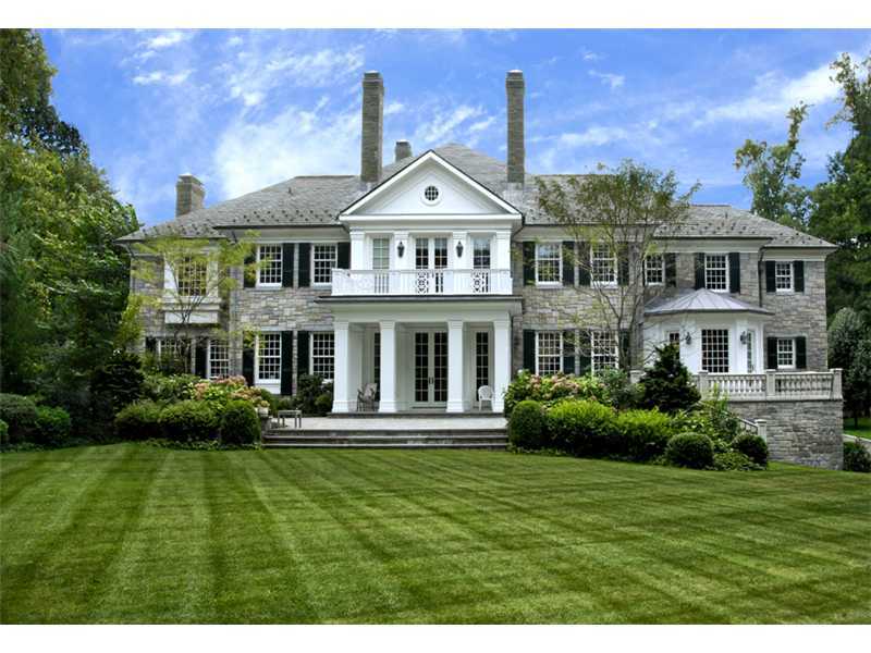 47 Round Hill Road Greenwich, CT 06831 - Photo 22 of 22 a front view of a house with a yard