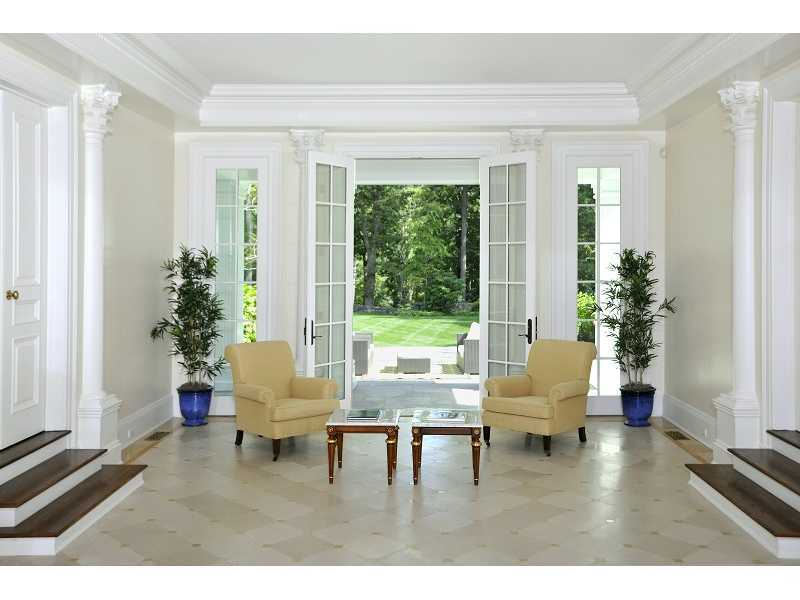 47 Round Hill Road Greenwich, CT 06831 - Photo 3 of 22 a living room with furniture and a potted plant