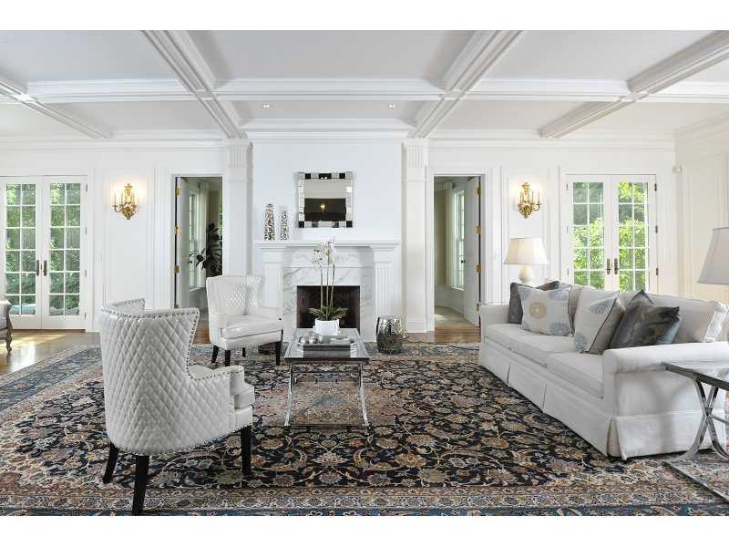 47 Round Hill Road Greenwich, CT 06831 - Photo 5 of 22 a living room with furniture a fireplace and a table