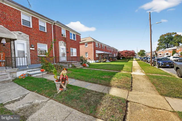 a front view of a building with garden