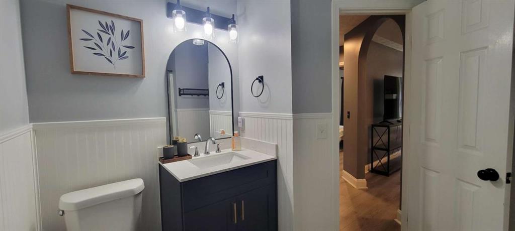 2140 Summerset Drive Monroe, GA 30656 - Photo 21 of 43 a bathroom with a sink and mirror with toilet