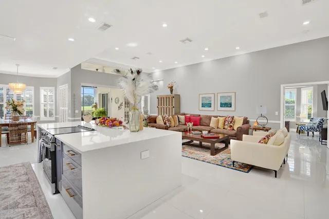 a large kitchen with stainless steel appliances lots of counter space and a sink