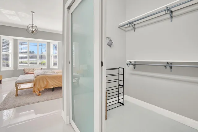 a bathroom with a double vanity sink toilet and shower