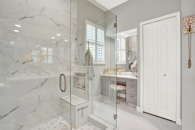 a bathroom with a double vanity sink mirror and double