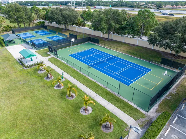 a view of house with a yard and sitting area
